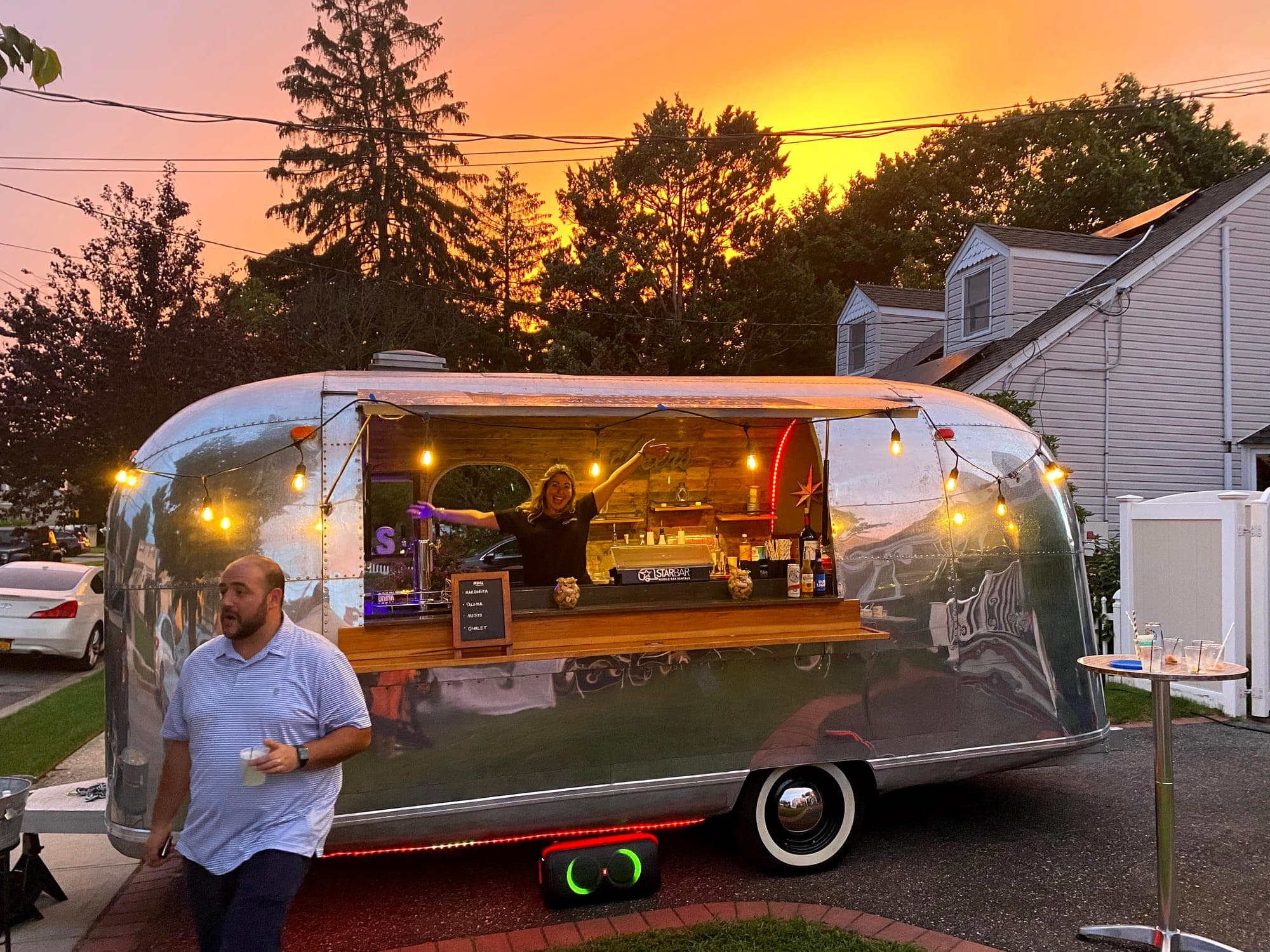 STARBAR NY 1967 Airstream mobile bar at a Long Island backyard event at sunset