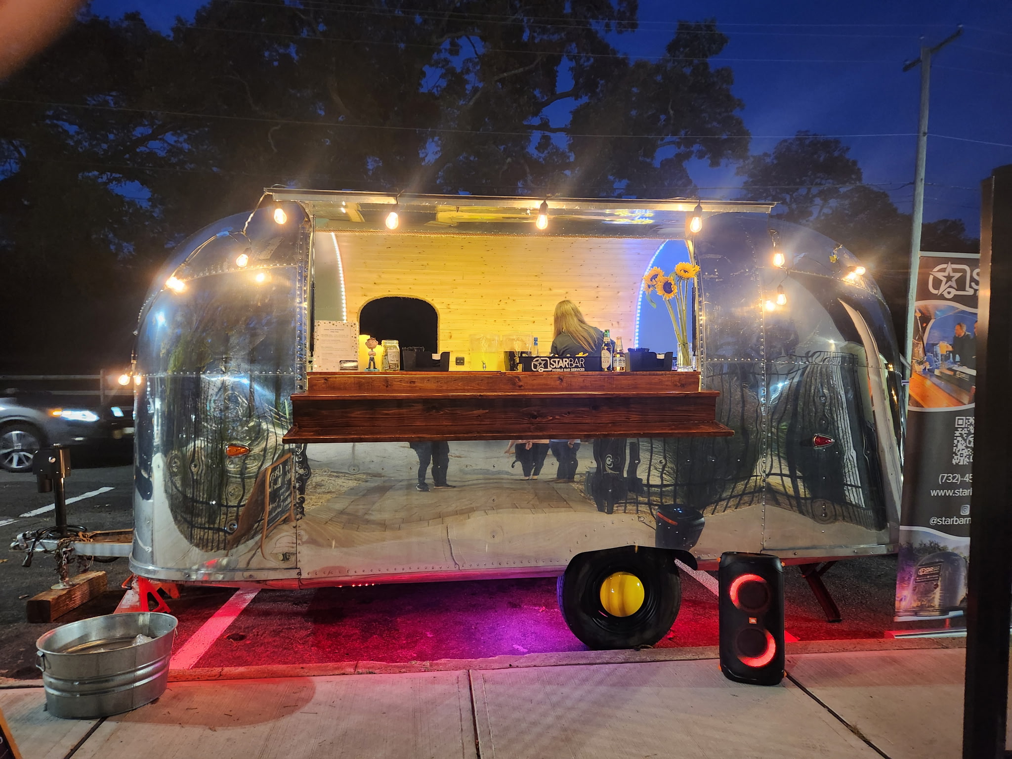STARBAR NY 1967 Airstream Globe Trotter mobile bar at an outdoor event